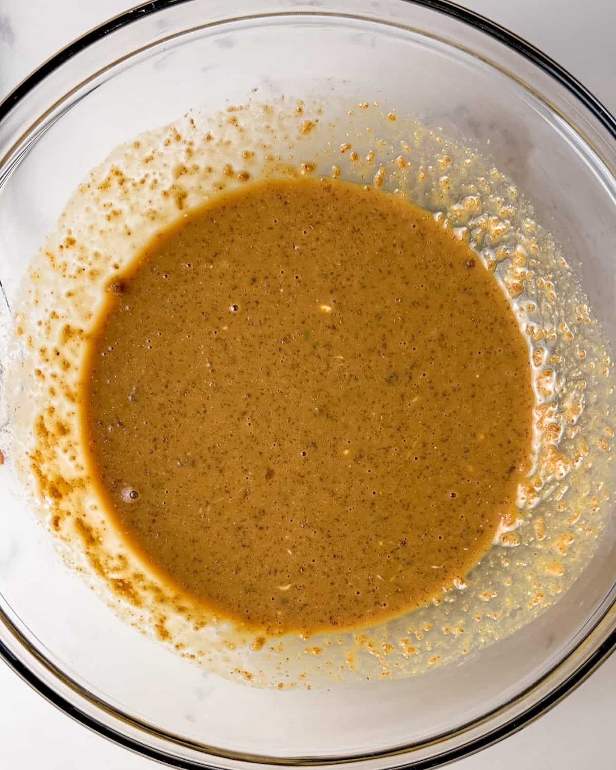 wet ingredients for Kodiak cakes muffins combined in a mixing bowl.